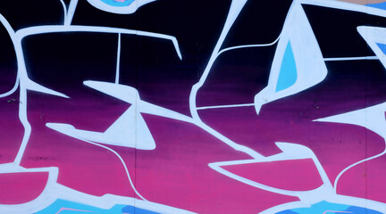 Colorful background of graffiti painting artwork with bright aerosol outlines on wall. Old school...