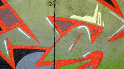 Colorful background of graffiti painting artwork with bright aerosol outlines on wall. Old school street art piece made with aerosol spray paint cans. Contemporary youth culture backdrop