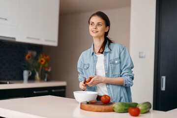 Kitchen Portrait: Young Female Cook Preparing Fresh Vegetarian Salad at Home
