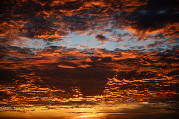 Fiery orange sunset sky in background. - 739035420