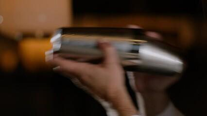 Bartender shaking a cocktail