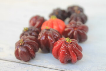 Bunch of ripe Surinam Cherry fruits on table 

