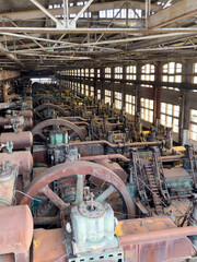 Interior image of the long factory floor with the heavy equipment and machinery used in the early 20th Century Steel Production at the Bethlehem Steel Works
