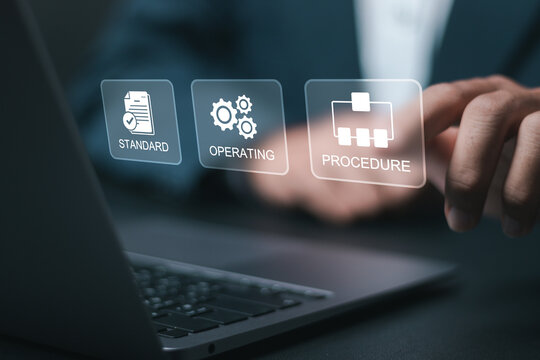 SOP, Standard operating procedure concept. Businessman use laptop with virtual SOP icons for the standard operating procedure with instruction, quality, process, operation, sequence, workflow.