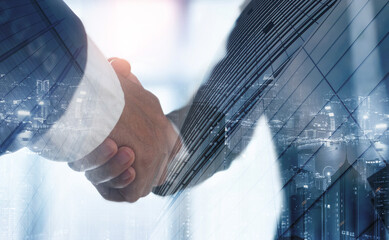 Double exposure of business handshake for successful of investment deal and the city, business teamwork and partnership concept. Businessmen making a handshake.