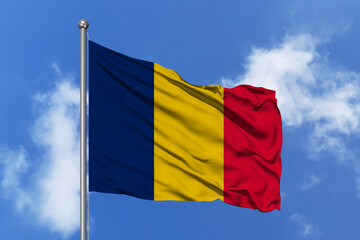 Chad flag fluttering in the wind on sky.