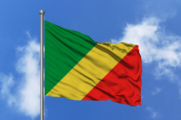Congo flag fluttering in the wind on sky.