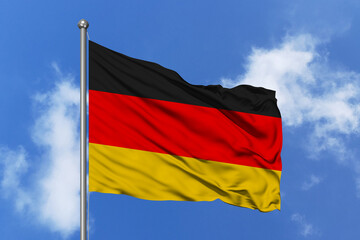 Germany flag fluttering in the wind on sky.