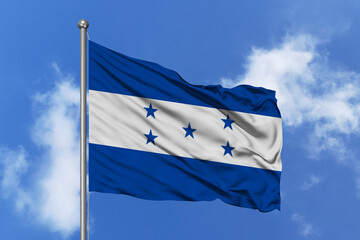Honduras flag fluttering in the wind on sky.
