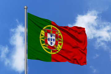 Portugal flag fluttering in the wind on sky.
