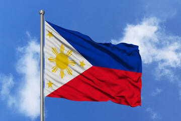 Philippines flag fluttering in the wind on sky.