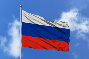 Russia flag fluttering in the wind on sky.