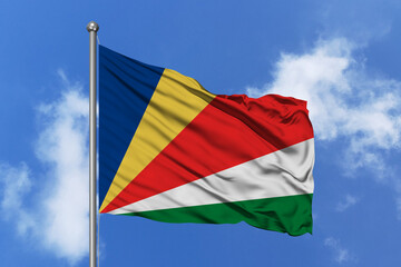 Seychelles flag fluttering in the wind on sky.