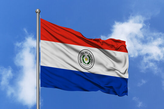 Paraguay flag fluttering in the wind on sky.