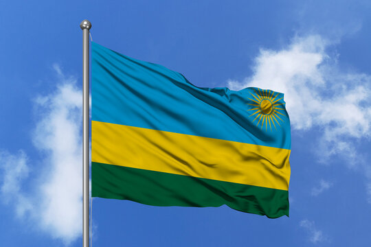 Rwanda flag fluttering in the wind on sky.