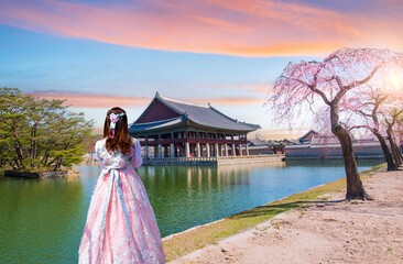 Woman wearing colorful hanbok Korean national costume with South Korea's spring in Gyeongbokgung...