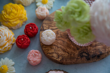 Candle in the shape of a flower peony