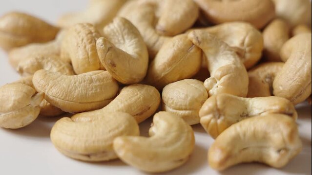 roasted salted cashew nuts background.