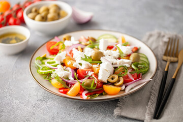 Greek salad of fresh cucumber, tomato, sweet pepper, arugula, red onion, feta cheese and olives...