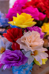 Colorful fake, articifial flowers on sale in a local market in the Seychelles.