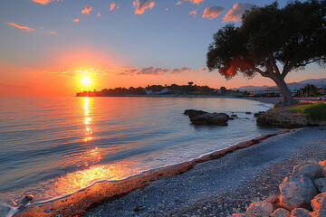 Horizon Sunset on a remote beach, sparse clouds
