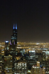 Fototapeta premium view of Chicago downtown at night from John Hancock skyscraper high above