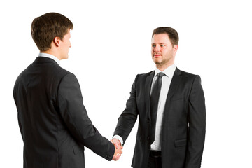 Two businessmen in suits shaking hands, isolated on a white background. Partnership concept