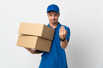 Young delivery blonde man isolated on white background inviting to come with hand. Happy that you...
