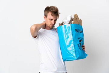 Young blonde man holding a recycling bag full of paper to recycle isolated on white background with...
