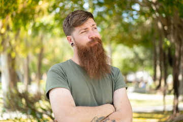 Naklejka na ściany i meble Redhead man with beard with confuse face expression