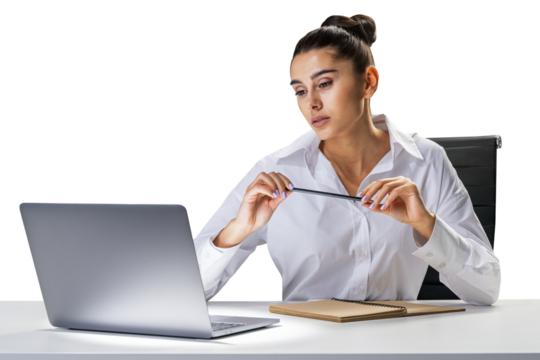 Thoughtful woman at office desk holding glasses, contemplating, with laptop and notebook