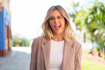 Pretty blonde Uruguayan woman With glasses and happy expression
