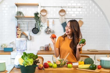 Fotobehang Portrait of beauty body slim healthy asian woman eating vegan food healthy with fresh vegetable salad in kitchen at home.diet, vegetarian, fruit, wellness, health, green food.Fitness and healthy food © Art_Photo