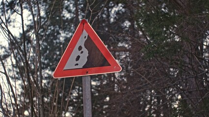Falling Rocks Caution Road Sign