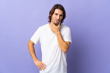 Young handsome man isolated on purple background having doubts
