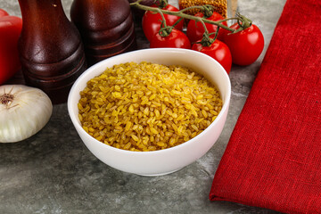 Dry wheat bulgur cereal heap