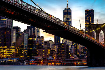 Fototapeta na wymiar Brooklyn Bridge and panoramic night view of downtown Manhattan after sunset in New York City, USA
