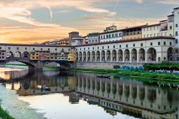 View of Florence at sunset with the Ponte Vecchio Bridge and the Arno River