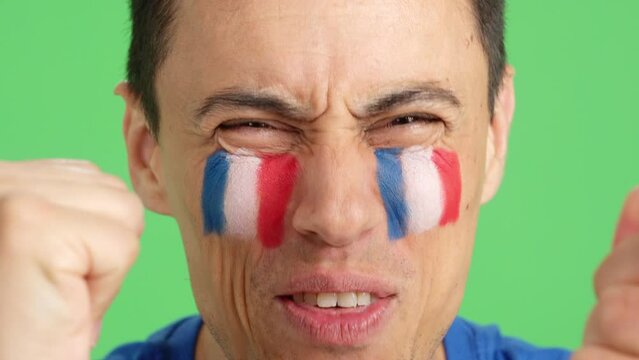 Close up of a man supporting french team
