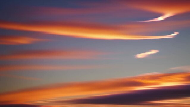 The ever-changing masterpiece of a sunset, condensed into a breathtaking time-lapse, where the sky becomes a symphony of colors, unfolding its drama as clouds glide in silent motion.
