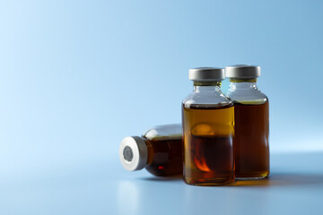 syringe for injectable medication on blue background