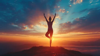 Foto op Canvas  silhouette of a person practicing yoga, with arms raised and body in a relaxed pose © Trevor