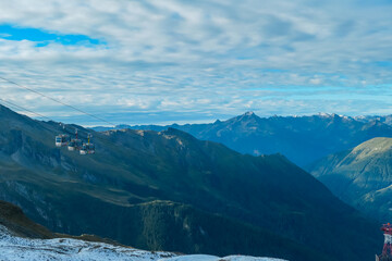 Fototapeta premium Panoramic morning view of ropeway Ankogelbahn, group cable car in High Tauern National Park, Carinthia, Austria. Wanderlust in Austrian Alps. Idyllic high altitude hiking trails at mountain Ankogel