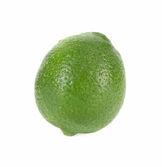 One whole fresh lime with water drops isolated on white