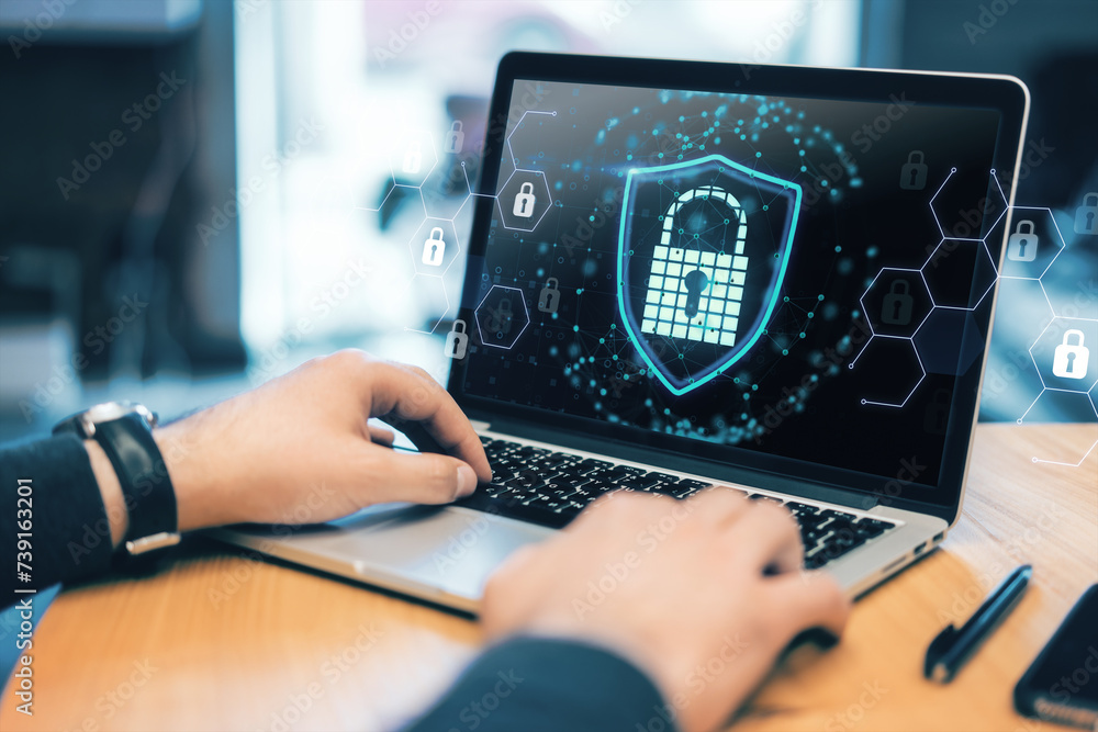 Poster Close up on hands typing on laptop with a cyber security lock symbol. Data protection concept