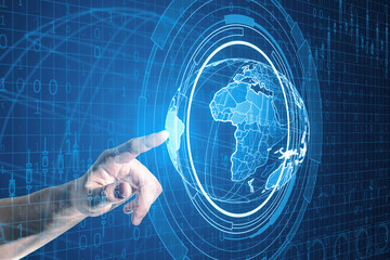 Close up of male hand using holographic screen with digital globe interface and business chart on blurry blue background. HUD, international stock and future monitor concept.