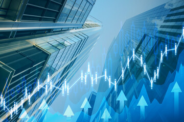 Abstract growing blue business chart with arrows on blurry toned city background. Future growth...