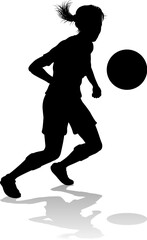 A female soccer football player woman in silhouettes