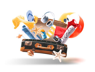 Flying open suitcase and beach accessories