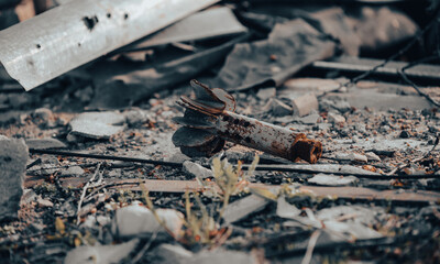 tail of an exploding mine on a city street in Ukraine